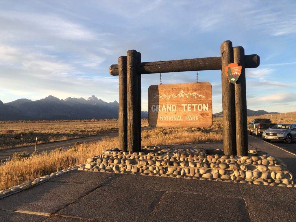 Grand Teton National Park sign at sunset